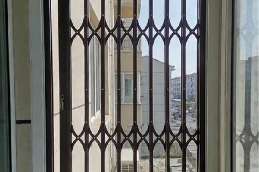 window guard installed on a 36 inch window with a child-safe lock