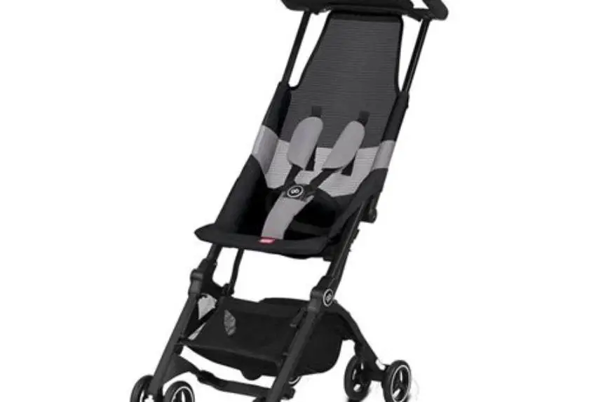Folded GB Pockit Air stroller beside airplane overhead bin